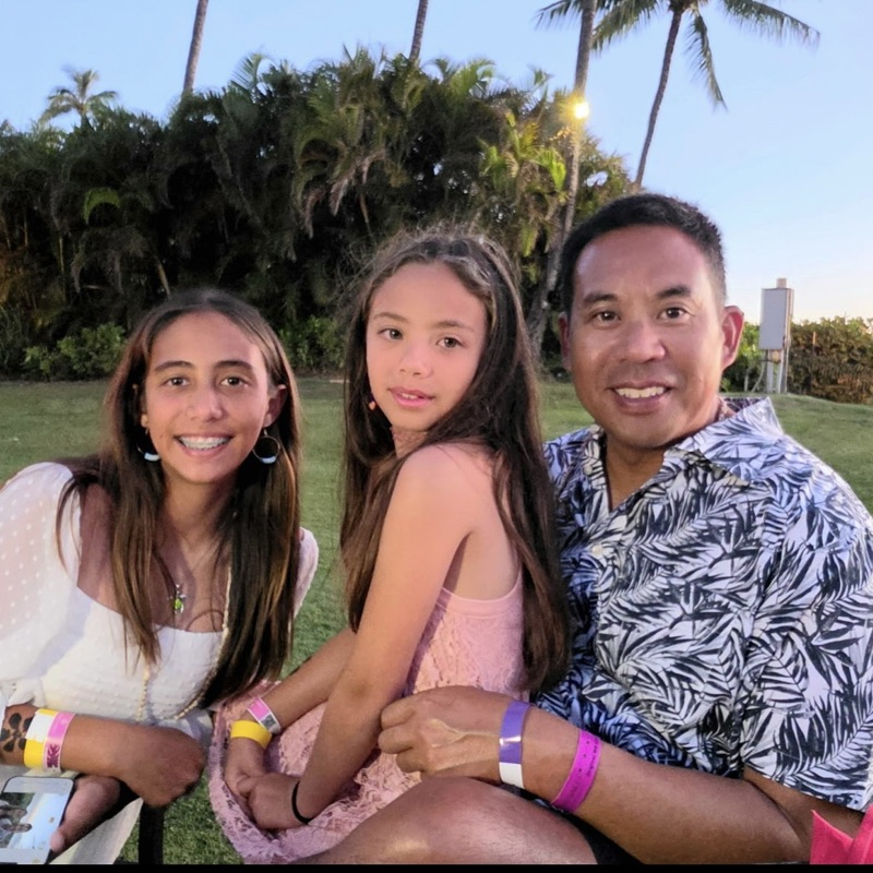 Chris Lee with his two daughters